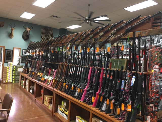 Vertical Gun Racks installed in a gun shop