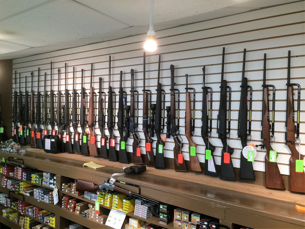 Vertical Gun Racks installed in a gun shop