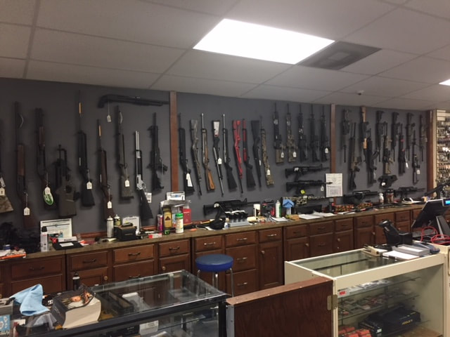 Vertical Gun Racks installed in a gun shop